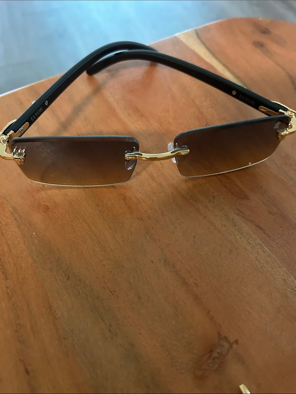 Men's Rimless Sunglasses with Gold Accent and Black Gradient Lenses